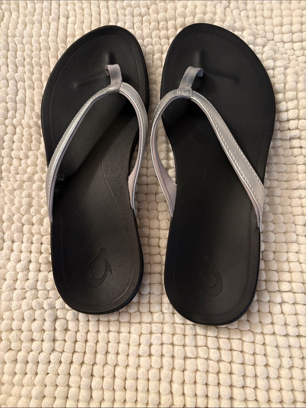 OluKai Black Footbed Sandals with Silver Straps women’s